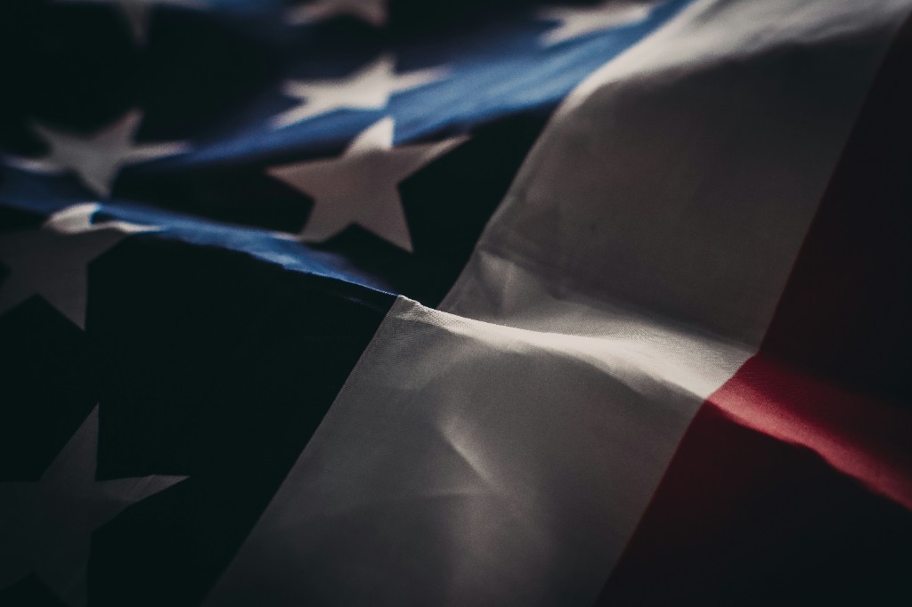 Draped United States flag representing the US immigrant visa backlog