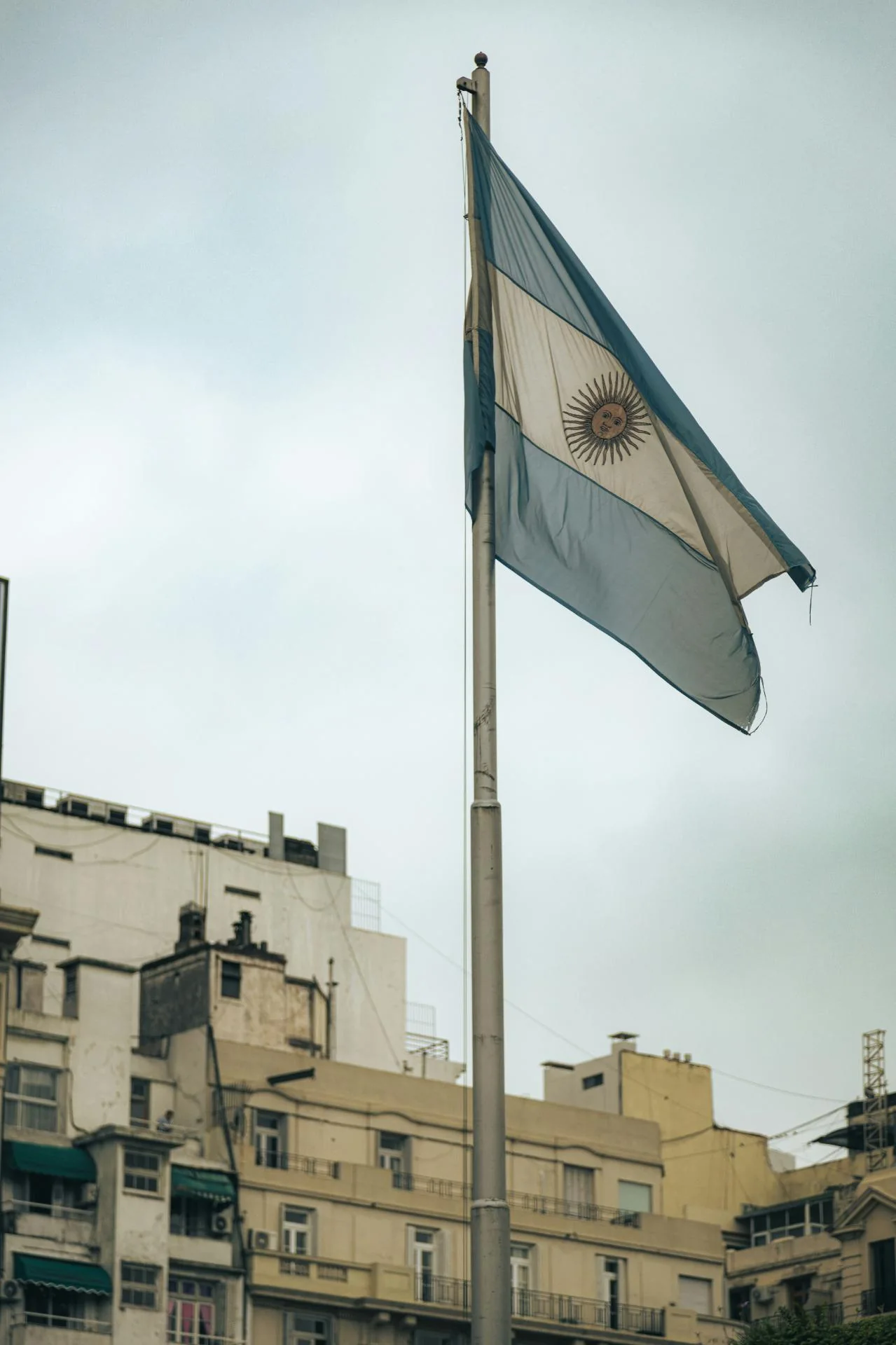 Argentine flag waving against a blue sky