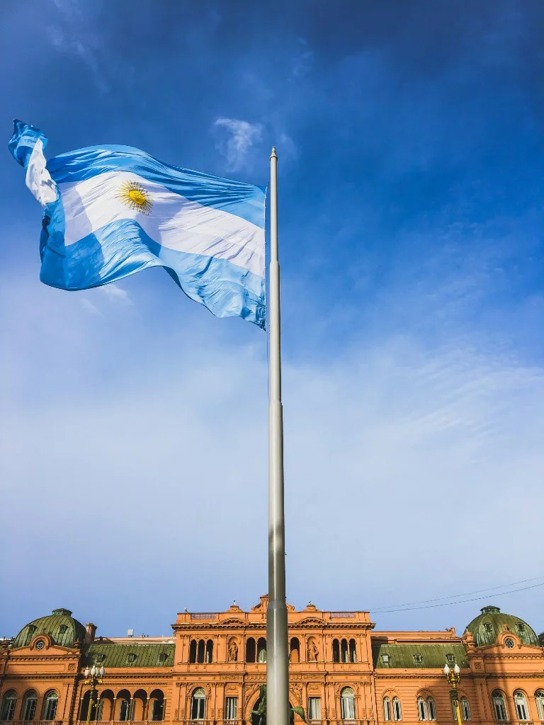 Argentine flag flying above Casa Rosada in Buenos Aires