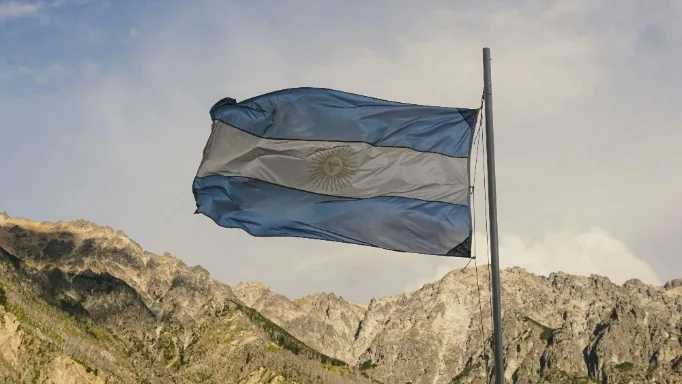 Argentine flag with mountains in the background