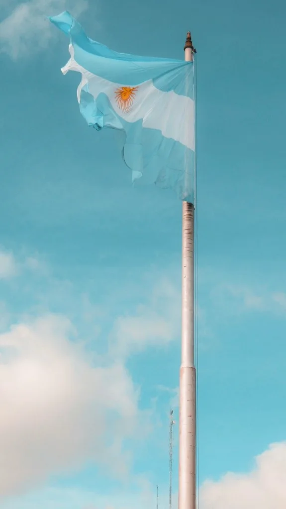 Argentine flag flying against a blue sky